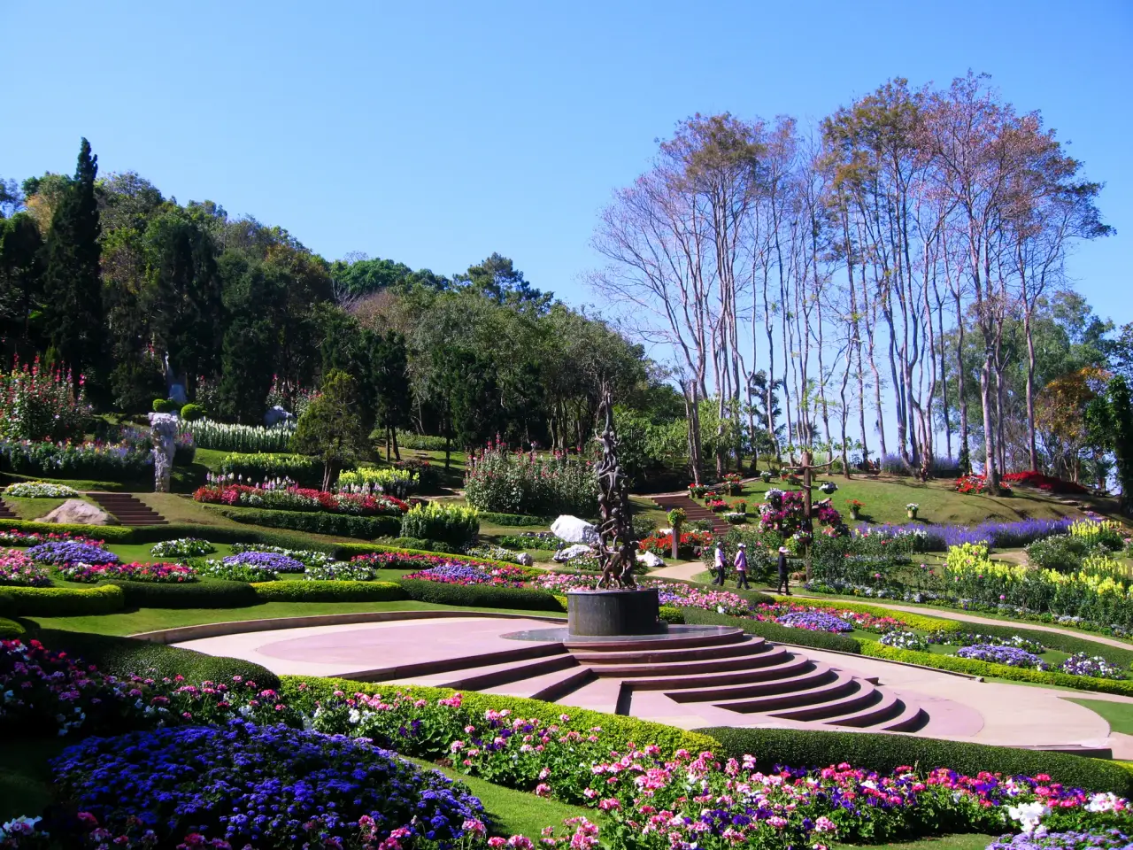 Colourful flower beds and trees in Mae Fah Luang Garden at Doi Tung.