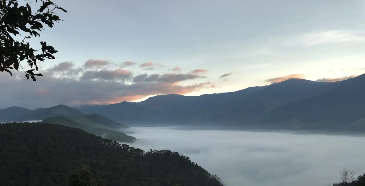 Dawn light and white mist above the mountain ridges around Sapan village in Nan.