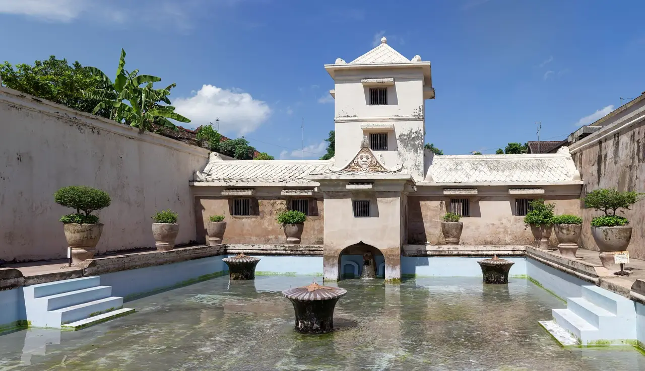 The complete central tower and bathing pools of Umbul Binangun at Taman Sari in Yogyakarta under a clear blue sky