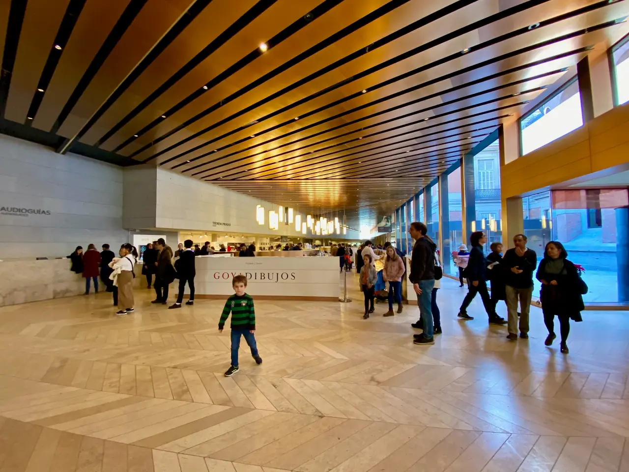 Visitors in the bright central hall of the Prado Museum in Madrid.