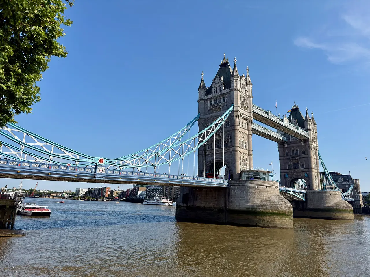 Tower Bridge’s towers and blue upper span over the River Thames in London