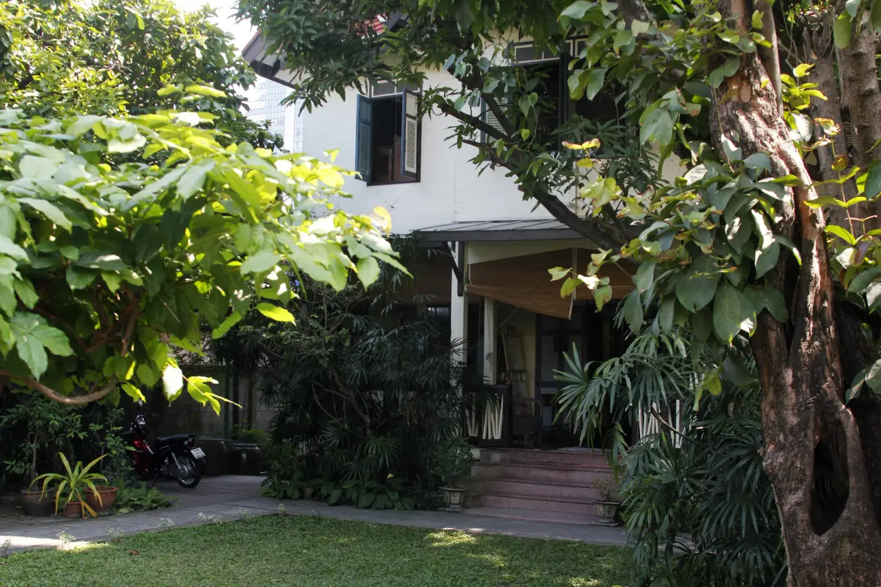 White heritage house and leafy garden at Bangkokian Museum