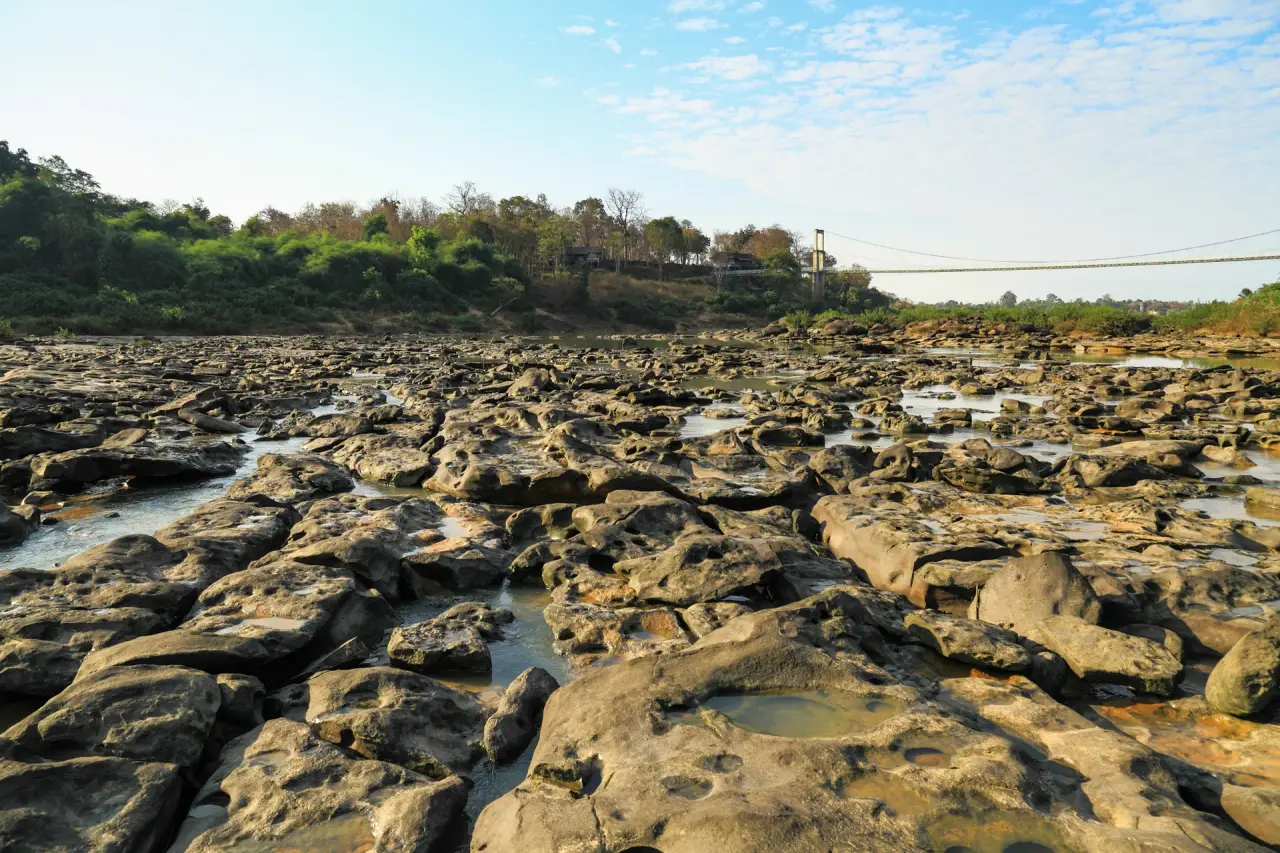Sunlit exposed river rocks at Kaeng Tana National Park in Ubon Ratchathani