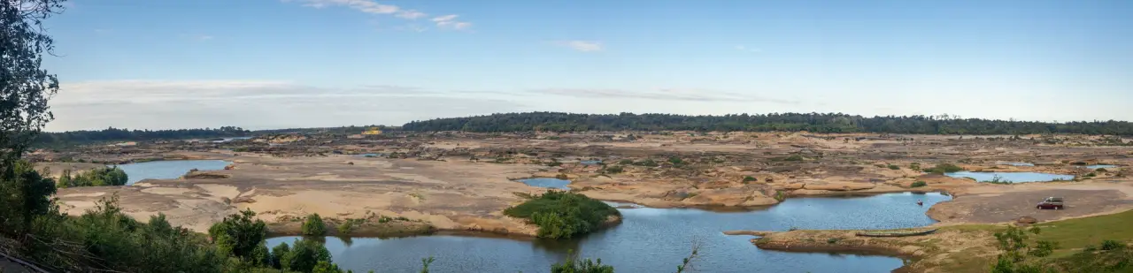 Exposed sandstone basins and a Mekong River channel at Sam Phan Bok