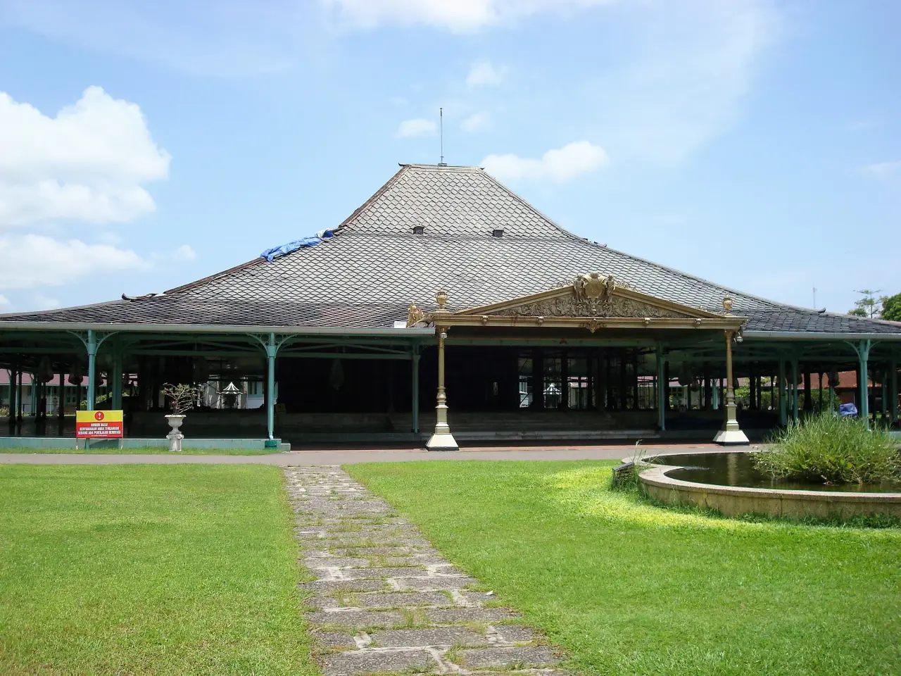 Open-sided pavilion and lawn at Mangkunegaran Palace in Solo.