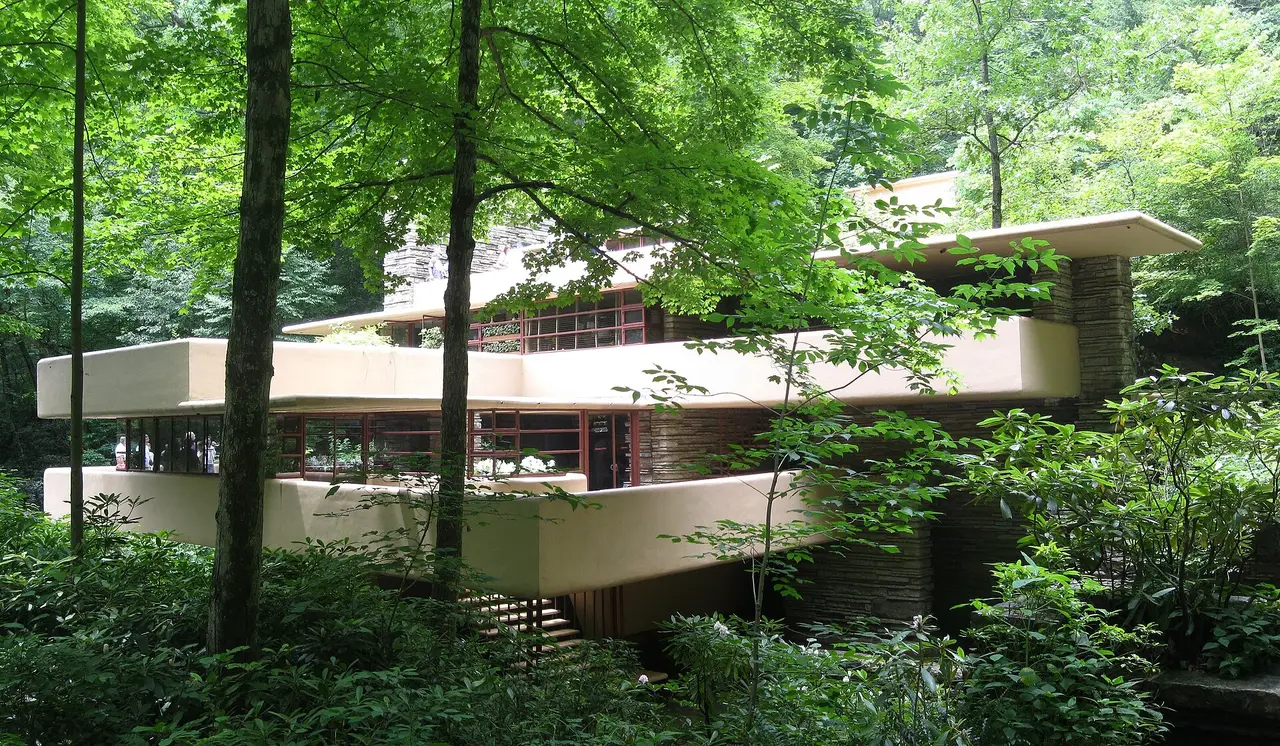 Fallingwater’s terraces and stone walls among bright summer trees in Pennsylvania
