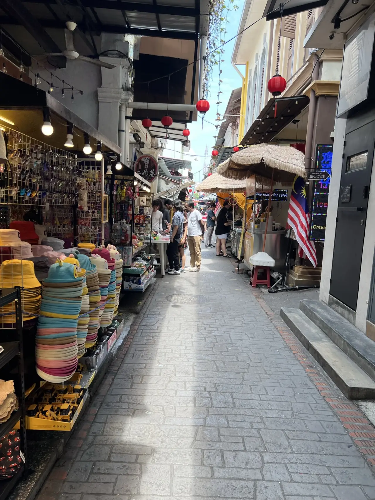 Visitors along colourful Concubine Lane on the old-town route in Ipoh, Malaysia.