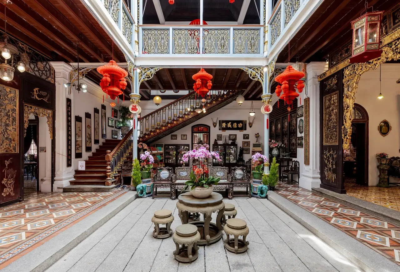 A stone table and stools in the ornate courtyard of Pinang Peranakan Mansion in George Town.