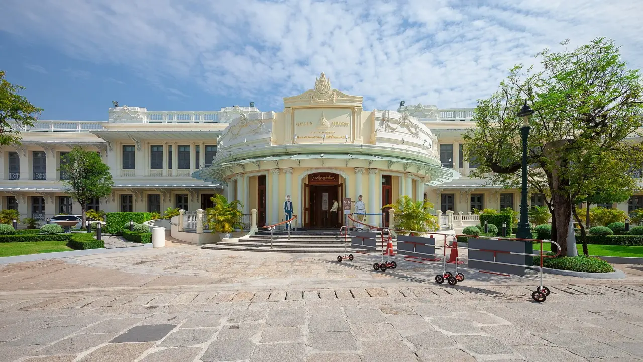 Queen Sirikit Museum of Textiles entrance and pale historic facade in the Grand Palace grounds