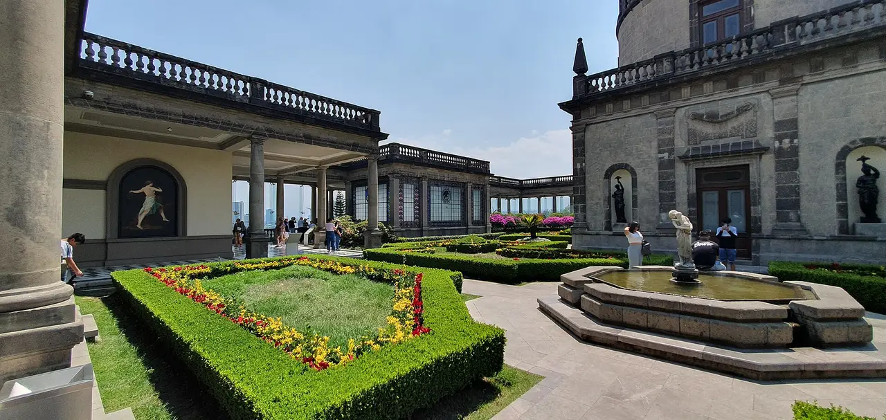 Clipped hedges, flowers and a fountain in the Alcázar garden at Chapultepec Castle in Mexico City