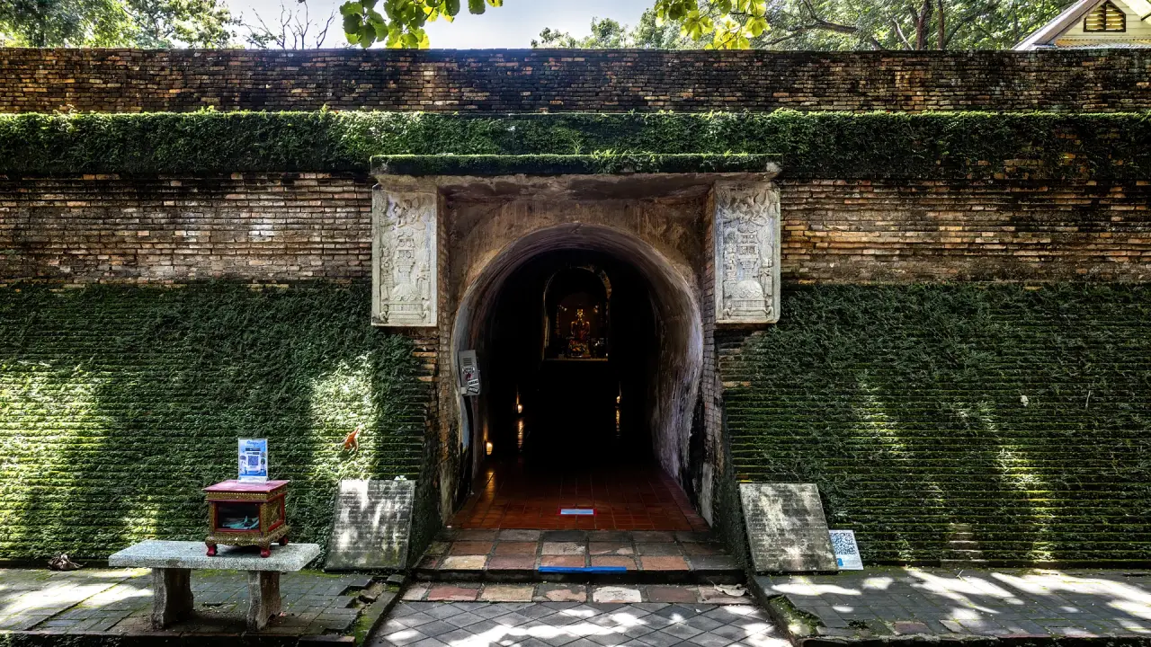 Brick tunnel entrance beneath the chedi at Wat Umong in Chiang Mai