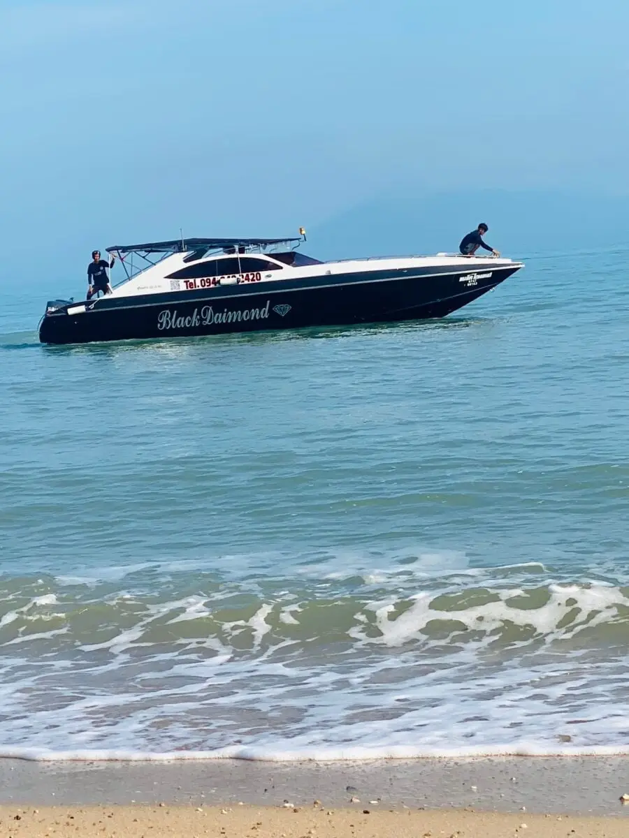 The private twin-engine Black Diamond speedboat off the beach