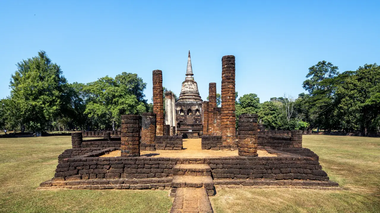 Wat Chang Lom ruins and chedi at Si Satchanalai Historical Park in sunny weather
