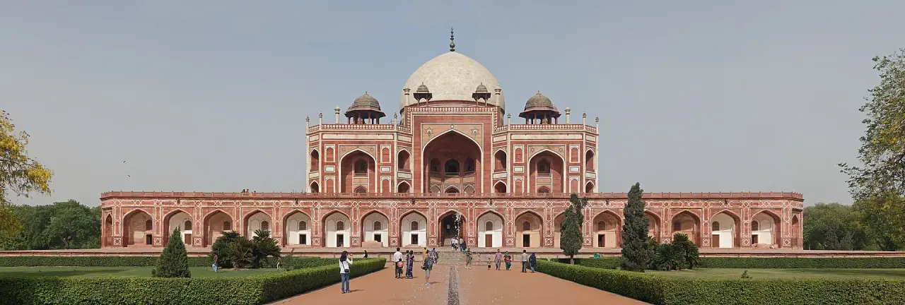 The complete central domed mausoleum of Humayun’s Tomb above red-sandstone arcades and green gardens in Delhi.
