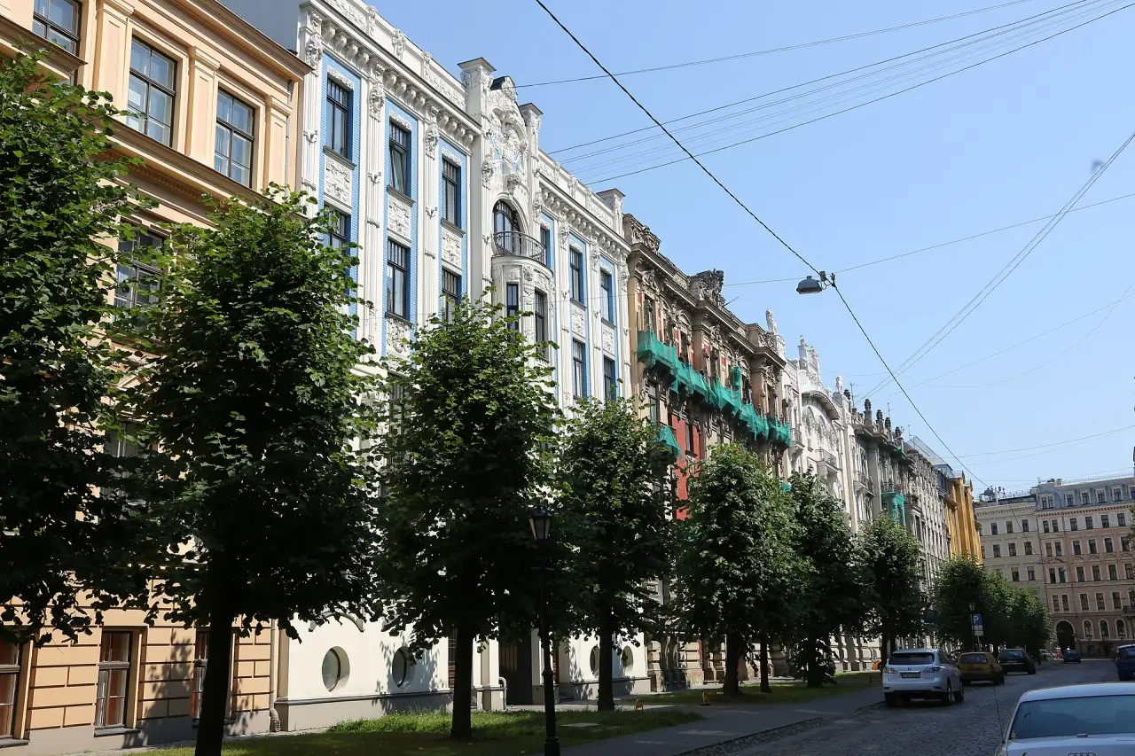 Ornate Art Nouveau facades along Alberta iela in Riga under a clear blue sky