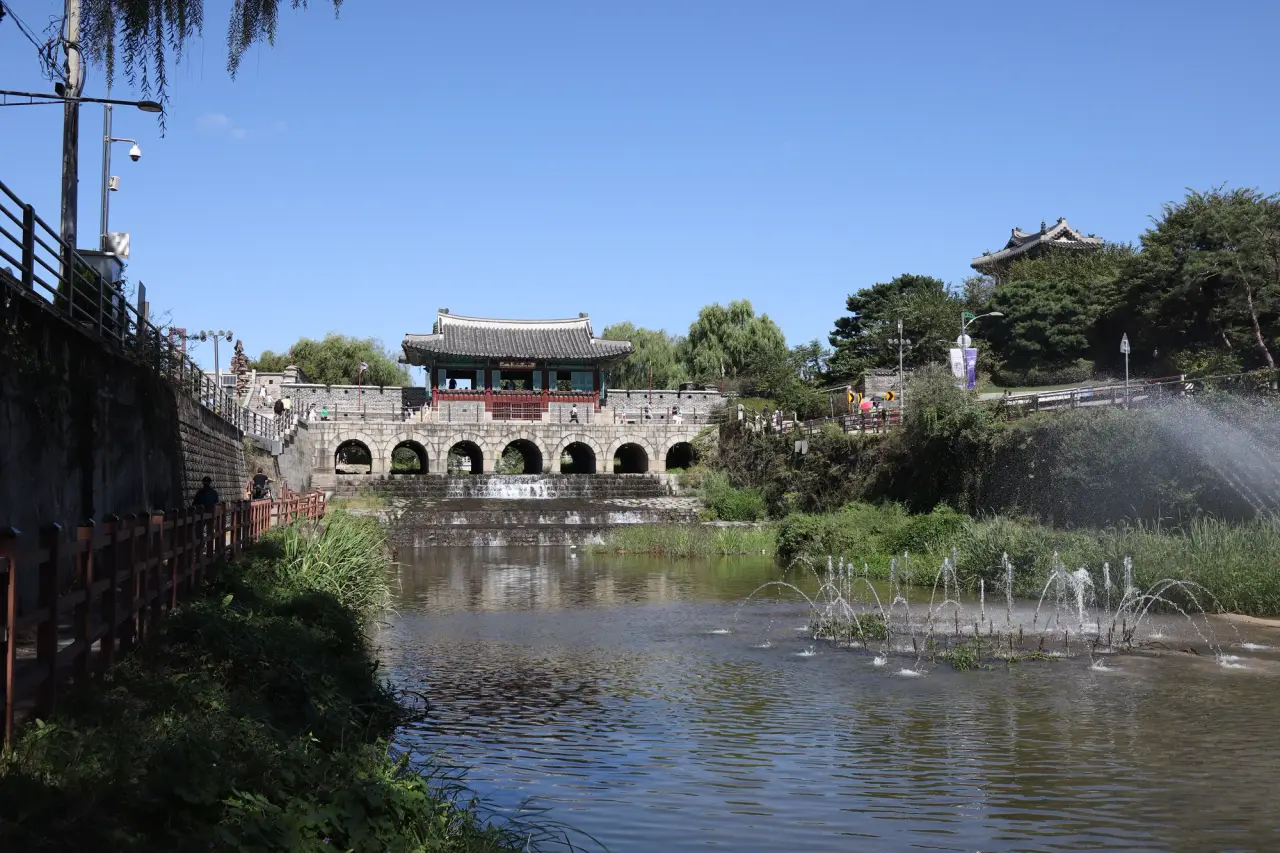Hwahongmun water gate and the Suwoncheon stream at Hwaseong Fortress in Suwon, South Korea