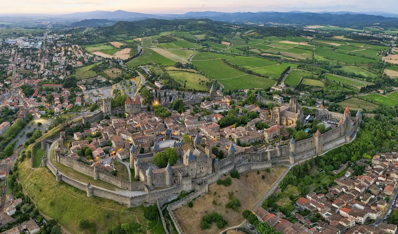 The complete fortified medieval city of Carcassonne and its surrounding countryside seen from above