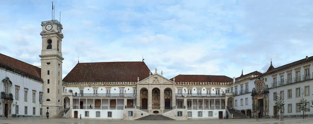 University of Coimbra’s clock tower beside the buildings of the Paço das Escolas
