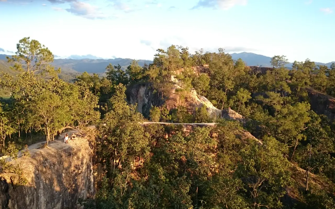 Sunlit ridges and forest at Pai Canyon